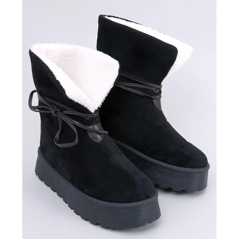 Bottes de neige noires en peau de mouton le noir