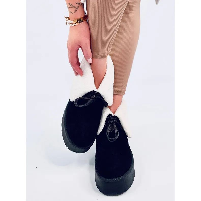 Bottes de neige noires en peau de mouton le noir