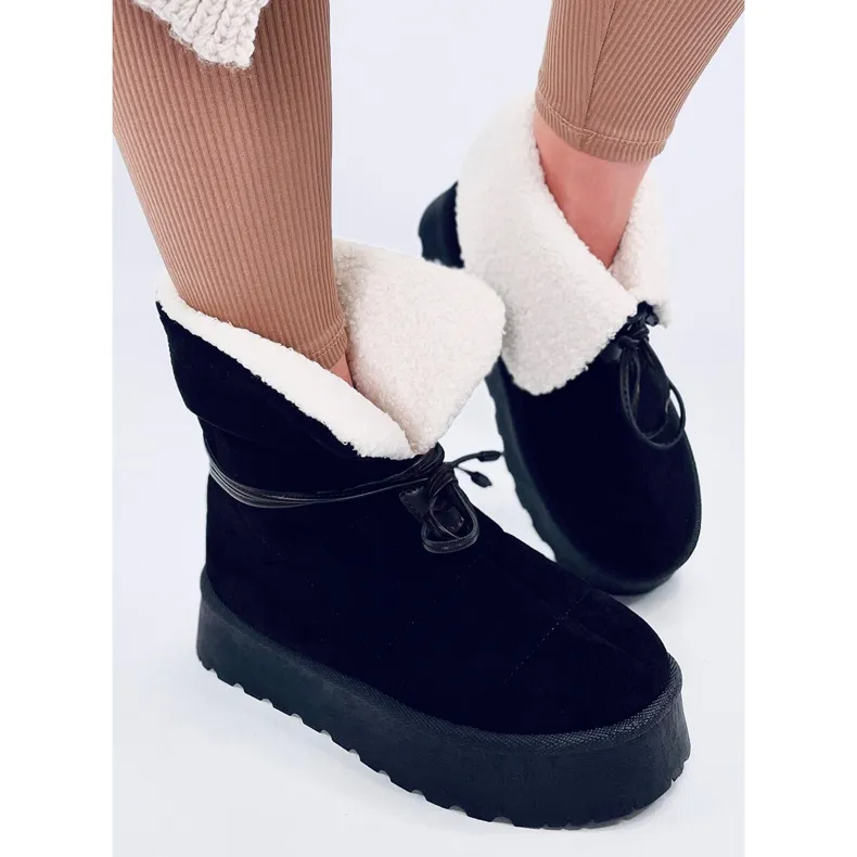 Bottes de neige noires en peau de mouton le noir