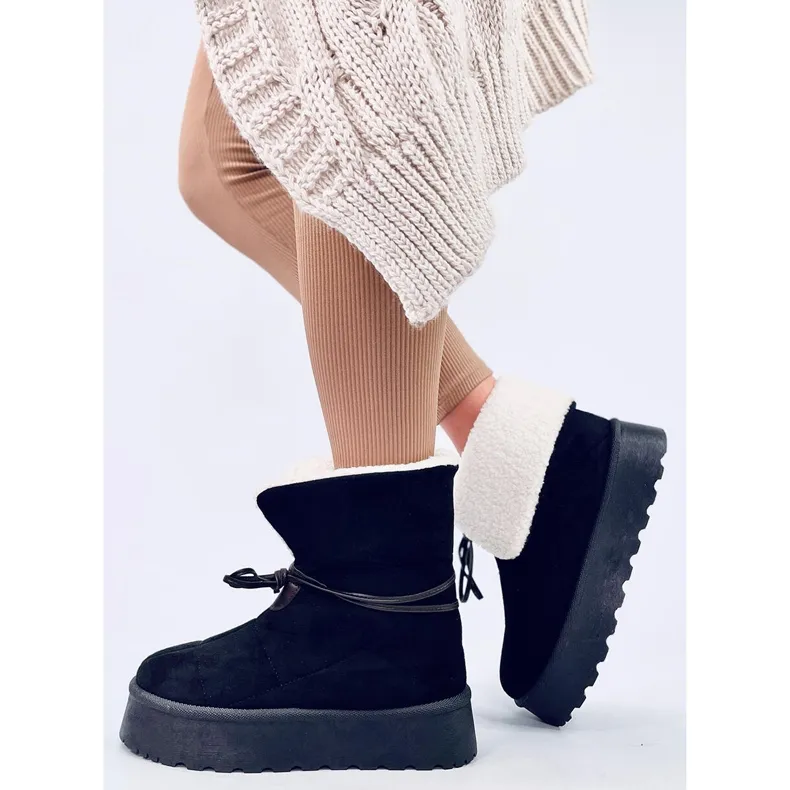 Bottes de neige noires en peau de mouton le noir