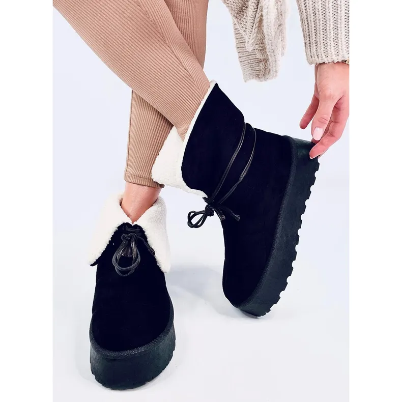 Bottes de neige noires en peau de mouton le noir